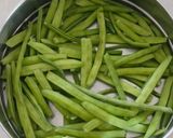 A picture of step 1 of Gawar aani Batata Upkari.