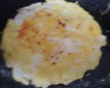 A picture of step 5 of Egg Ghotala with omelette.