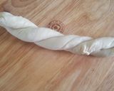 A picture of step 6 of White chapati (oiled thrice and rolled out twice).