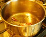 A picture of step 3 of Drum stick tomato masala curry (sambar) mixed with rice.