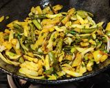 A picture of step 5 of Runner beans and potato fry with onion and onion greens.