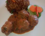 A picture of step 9 of Meat balls in tomato Concasee' with stir fried rice.