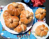 A picture of step 15 of Pumpkin shaped dinner rolls.
