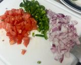 A picture of step 2 of Yellow Rice with Jalapeños and Tomatoes.