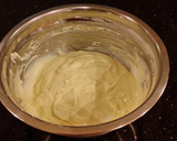 A picture of step 4 of Hazelnut Layer Cake with Hazelnut Cream Frosting.