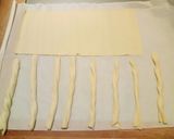 A picture of step 1 of Puffy pastry twists wrapped in parma ham.