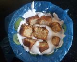 A picture of step 6 of Lemon cake pudding with upside down kiwi whipped cream frosting.