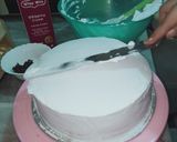 A picture of step 5 of Vanilla cream cake with chocolate chips inside.