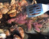 A picture of step 3 of Paella with Vegetables and Meat.