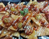 A picture of step 7 of Cornitos with tomato salsa and cheese sauce.