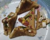 A picture of step 9 of पुफ पैनर पिज्जा सैंडविच.
