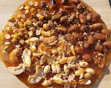 A picture of step 11 of Mixed nuts chikki pizza (chizza).