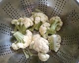 A picture of step 1 of Cauliflower bhetki curry.