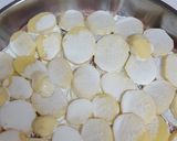 A picture of step 2 of Meat with potatoes in the oven.