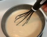 A picture of step 3 of Bobby&Whittney”s Homemade Penne Chicken Alfredo with broccoli and shrimp.