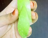 A picture of step 2 of Bunny- shaped green apple wedges.