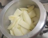 A picture of step 1 of Kache aam ka sharbat.