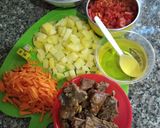 A picture of step 16 of Sinasir with potato vegetable sauce.