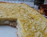 Foto del paso 5 de la receta: Torta de atún, cebolla, jamón y queso.