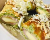 Foto del paso 4 de la receta: CANELONES DE 🥞PANQUEQUES 🥞 VERDES RELLENOS DE 🍖JAMÓN Y QUESO 🧀😋🤩👏