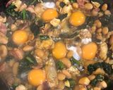 A picture of step 6 of Smoked haddock, kale and butterbean baked eggs.
