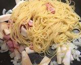 A picture of step 4 of Japanese style! Bacon and Mushroom pasta with butter and soy-sauce!.