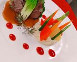 A picture of step 13 of Herb Roasted Lamb Rack with Juslie, Ruby Reduction & Mash Potato.