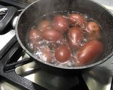 A picture of step 11 of Warm Potato and Asparagus Salad with Bacon, Tomatoes, and Sweet Onion.
