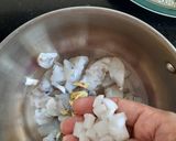 A picture of step 2 of Prawns Coconut Recipe Prawns Thengakoth Coconut slices ularth.
