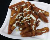 A picture of step 4 of Baby Corn fingers with cheesy dip.