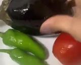 A picture of step 1 of Baingan ka bharta (with roasting method).