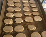 A picture of step 8 of Spiced Swiss roll cookie slices.