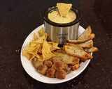 A picture of step 6 of Potato Skin Dippers with Sausage Cheese Dip with Chips and Meatballs.