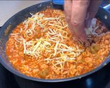 A picture of step 7 of Chicken Enchiladas with Pickled Peppers.