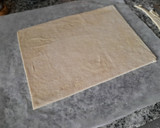 Foto del paso 2 de la receta: Espiral de hojaldre relleno de crema de melocotón y chocolate