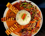 A picture of step 5 of Spicy Grilled Paneer Steak Italian Herb Rice Schezwan Sauce With Exotic Sautéed Veggies Gourmet Meal.