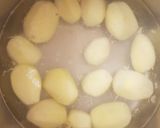 A picture of step 1 of Corned Beef Hash with a fried egg on top.