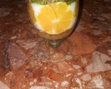 A picture of step 7 of Kunafa and Qashtalia Decorated with Oranges, Strawberries, and Bananas.
