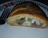 A picture of step 12 of Philly cheesesteak crescent roll.