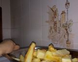 Foto del paso 14 de la receta: Papas al horno PASADAS POR HARINA