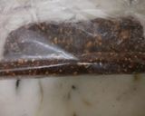 A picture of step 7 of Til and peanuts date roll.