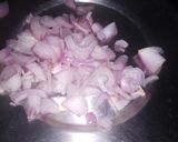 A picture of step 1 of Onian tomato carrot salad.
