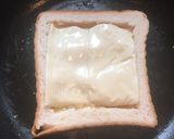 A picture of step 6 of Cheesy Egg Toast.
