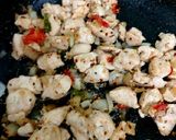 A picture of step 6 of My Salt n Chilli Peppered Chicken on a folded flatbread. 😋.
