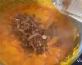 A picture of step 6 of Fufu with egusi soup.