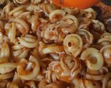 A picture of step 10 of Dischi Volanti Vegetable Bolognese.