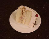 A picture of step 33 of White Layer Cake with a Raspberry Swirl Cheesecake center layer and a Raspberry Cream Frosting.