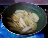 A picture of step 2 of Garlic Potato Wedges.
