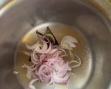 A picture of step 1 of Onion Pulao Sindhi style.