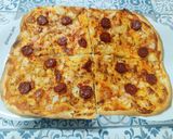 Foto del paso 5 de la receta: Pizza ibérica de chorizo y cebolla